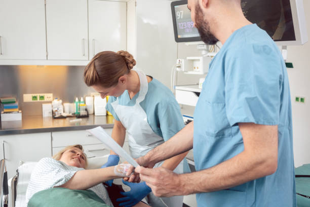 Doctor greeting patient before starting treatment Doctor greeting patient before starting treatment in hospital colonoscopy stock pictures, royalty-free photos & images