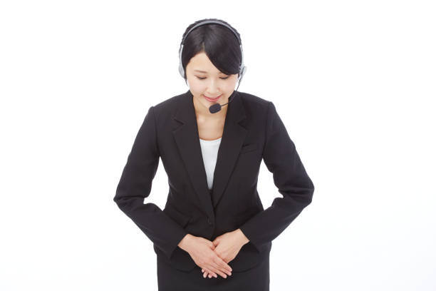 istock bowing Asian woman 996855682