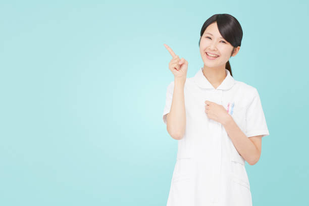istock Asian woman pointing side 996861374