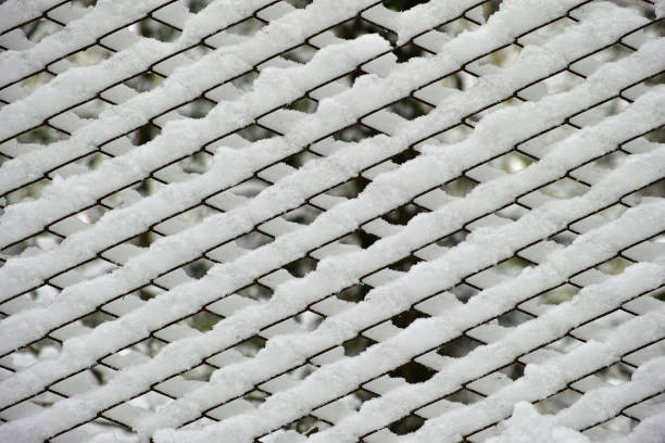snow deposited on a fence net