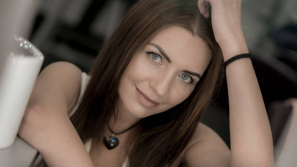 istock Beautiful woman with professional makeup looking at camera 996861688