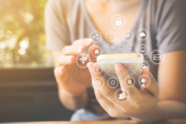 istock Asian woman hand using smartphone with icon technology communication and internet of things (IOT). Innovative convenience smart life concept 996865256
