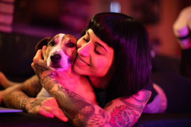 istock Beautiful young woman with dog 996866064