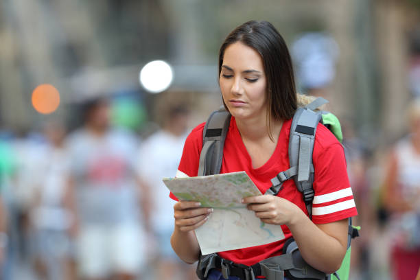 istock Frustated teen tourist reading a map 996868586