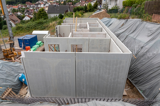 unfinished construction site of a family house with ready to use walls