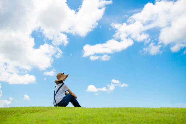 Woman relaxing in a meadow