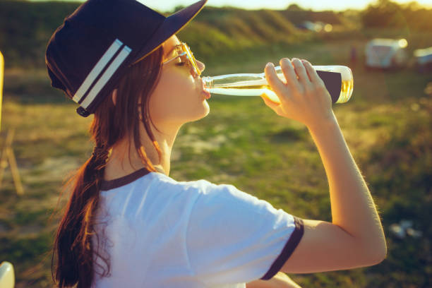 istock Woman drinking lemonade at park 996886908