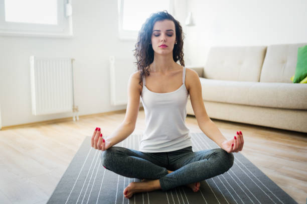 istock Young attractive woman relaxing and practicing yoga 996895160