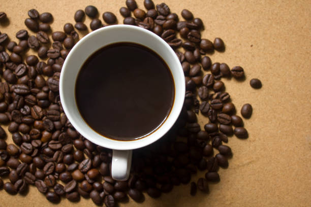 istock Milk froth in coffee mugs and coffee beans 996898168