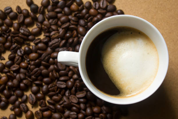 istock Milk froth in coffee mugs and coffee beans 996898352