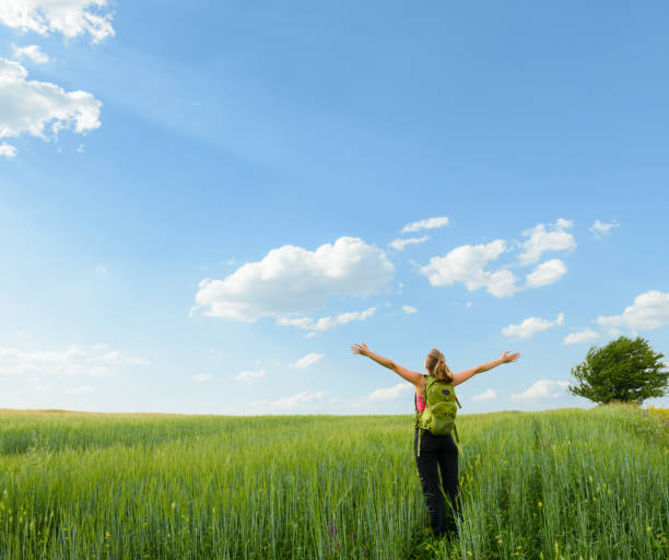 istock Positive woman in wheat field 996901878