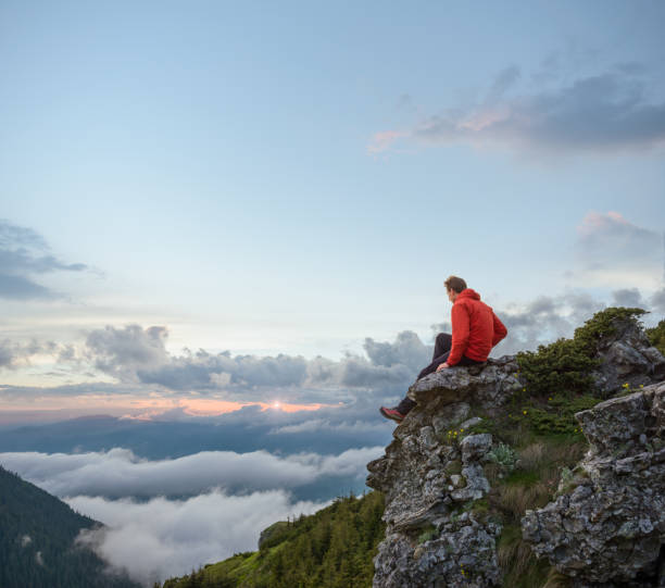 istock Man admiring the sunset in the mountains 996901962