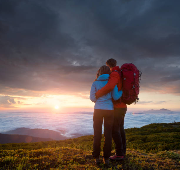 istock Couple looking at view in the mountains 996902050