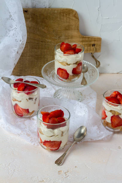istock Strawberry tiramisu. Glasses. Silver spoons. Light background. 996902404