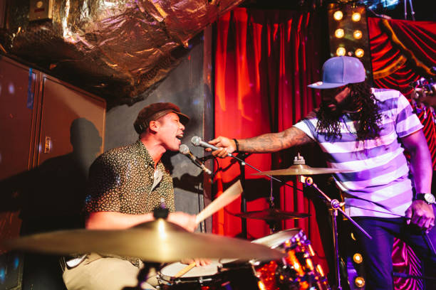 istock Japanese drummer with African American vocal singing songs while playing drum 996902872