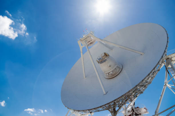 istock Big white radio telescope at summer day 996904814