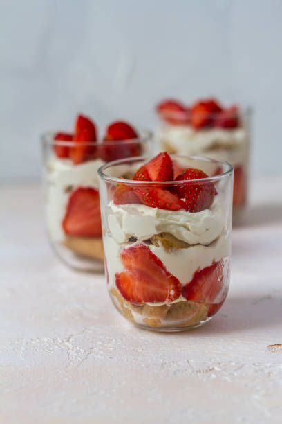 istock Strawberry tiramisu. Glasses. Silver spoons. Light background. 996913906