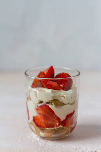 istock Strawberry tiramisu. Glasses. Silver spoons. Light background. 996913908