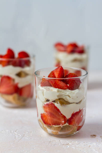 istock Strawberry tiramisu. Glasses. Silver spoons. Light background. 996914500