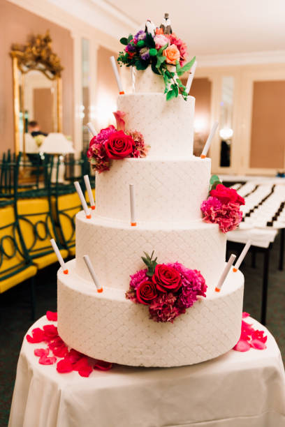 istock White Wedding Cake with Penguins Newly Wed Figures 996916452