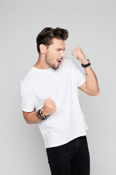 istock Excited young man celebrating success 996917432