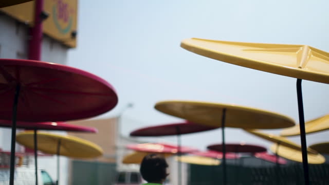 Metal Outdoor Seating Umbrellas at a HotdogStand