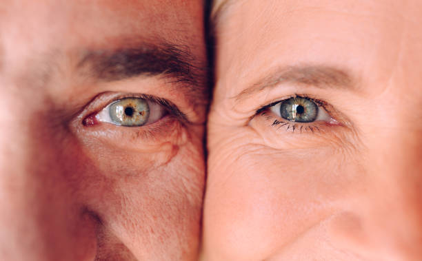 close-up of mature man and woman's faces with green eyes - latin american and hispanic ethnicity senior adult mature adult couple imagens e fotografias de stock