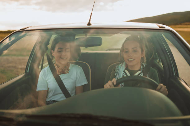 istock Happy twin sisters having a road trip 996927246