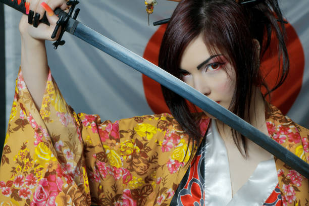 istock Cute asian girl with katana 996931286