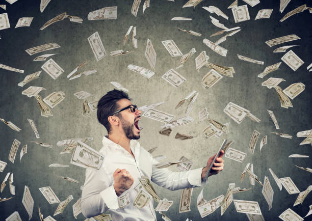 istock Successful young man using tablet building online business earning money 996937958