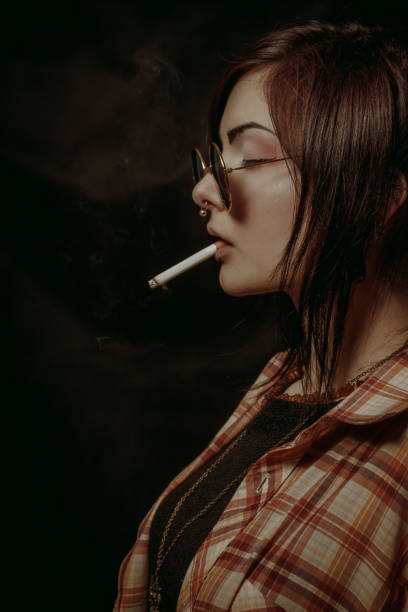 istock Cute girl with cigarette 996938128