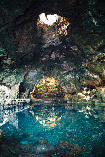 amazing salt lake in jameos del agua cave - beautiful blue sport vertical imagens e fotografias de stock