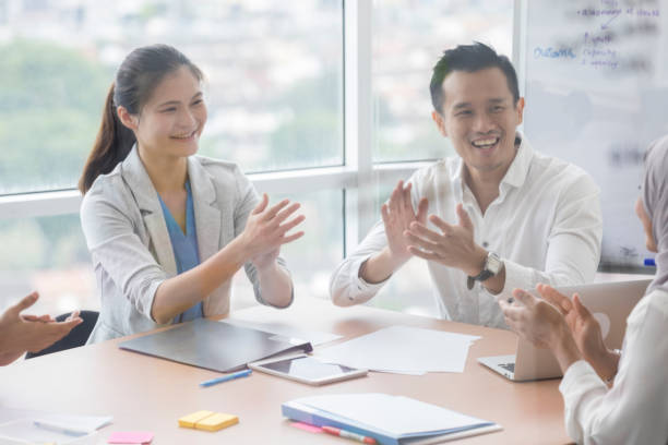 istock Confident businesspeople applaud after a presentation 996939540