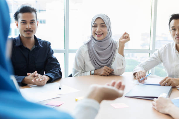 istock Attentive business colleagues listen during presentation 996939652