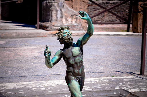 Pompeii ruins, the impluvium of the bronze statue of the faun or dancing satire. Pompeii is an ancient Roman town destroyed by vesuvius eruption in 79 BC