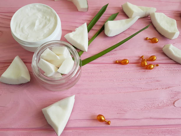 istock cream, avocado on a pink wooden background, capsules 996948378