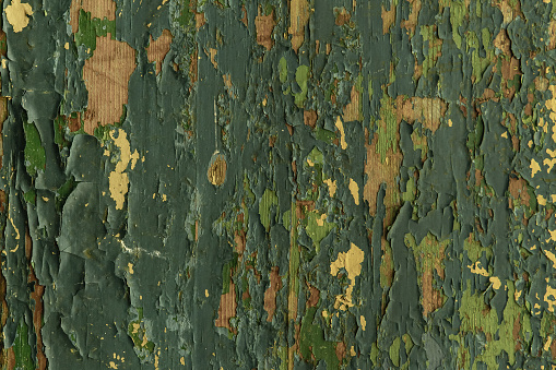 background old board with peeling paint green, texture.
