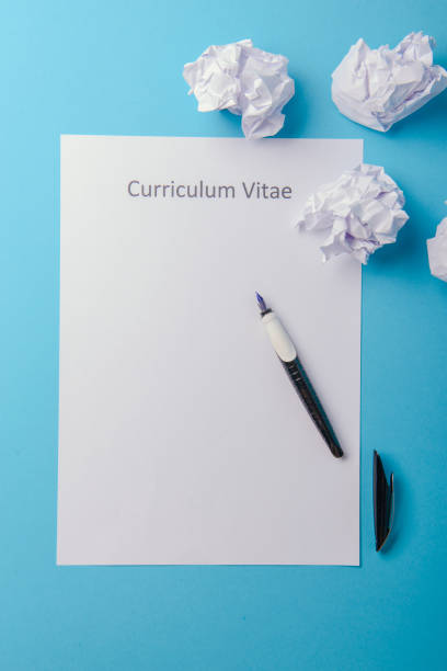 istock Curriculum vitae written on an blank white paper 996952756