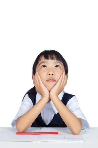 asiatique chinoise petite fille portant des études uniforme scolaire - child adversity isolated on white boredom photos et images de collection