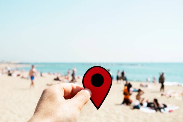 istock man with a red marker in La Barceloneta beach 996966048