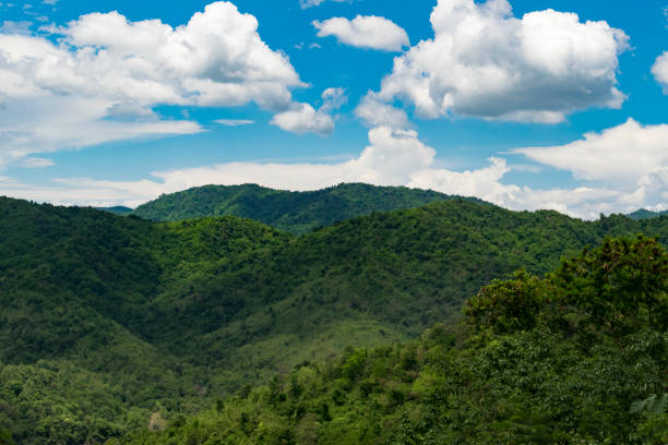 istock Mountains on the sky horizon. Blue sky with clouds 996974634