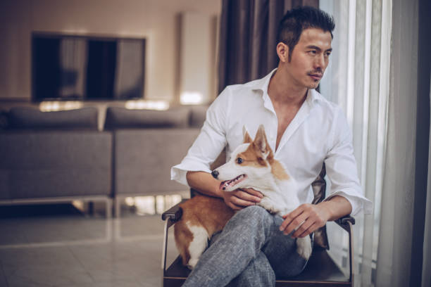 istock Gentleman with pet dog 996975530