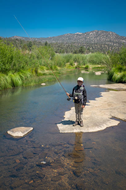 istock 8 Year Old Boy Fly Fishing 996975590