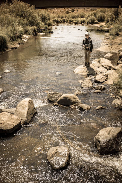 istock 8 Year Old Boy Fly Fishing 996976008