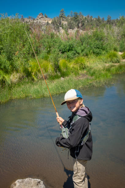 istock 8 Year Old Boy Fly Fishing 996976056