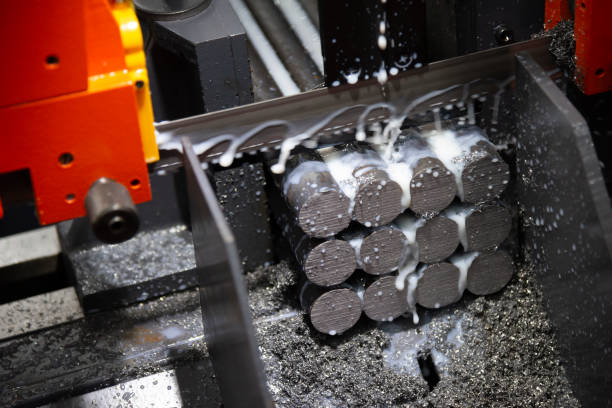 istock The raw material rods on the band saw machine 996976200