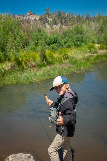 istock 8 Year Old Boy Fly Fishing 996976498