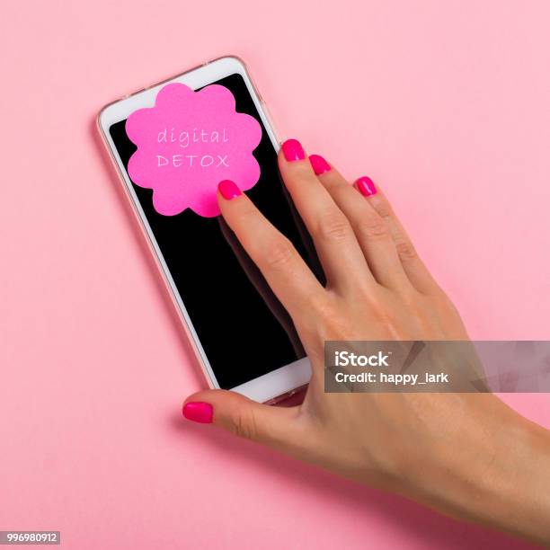 Female Hand Reaching For Cell Phone Stock Photo - Download Image Now - Detox, Digital Display, Pink Color