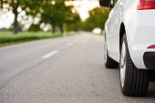 istock White car standing on the road 996990890