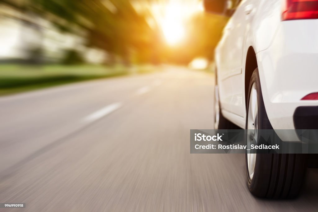 Car ride on road with copy space, motion blur Car ride on road at sunset with copy space, motion blur Car Stock Photo